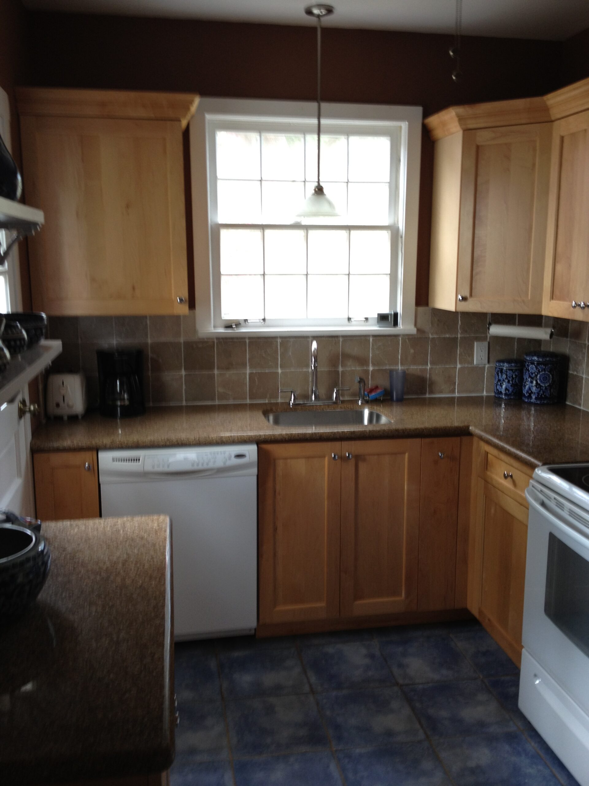 Kitchen: Before. Blue tile, brown speckled countertops, tan backsplash, natural wood cabinets, white appliances, brown walls....this room needed some love! 