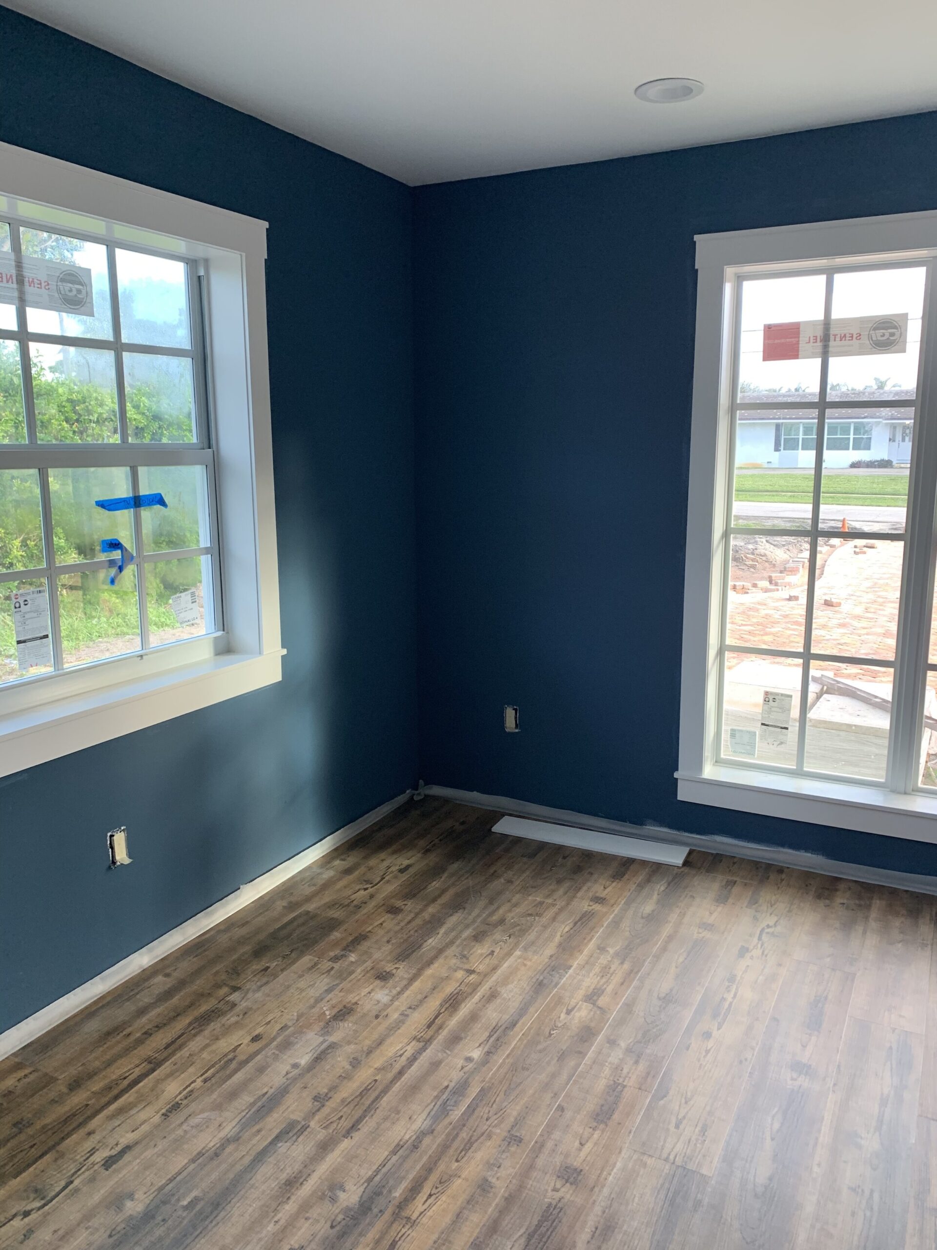 Floors installed in the office (wall color BM Van Deusen Blue)