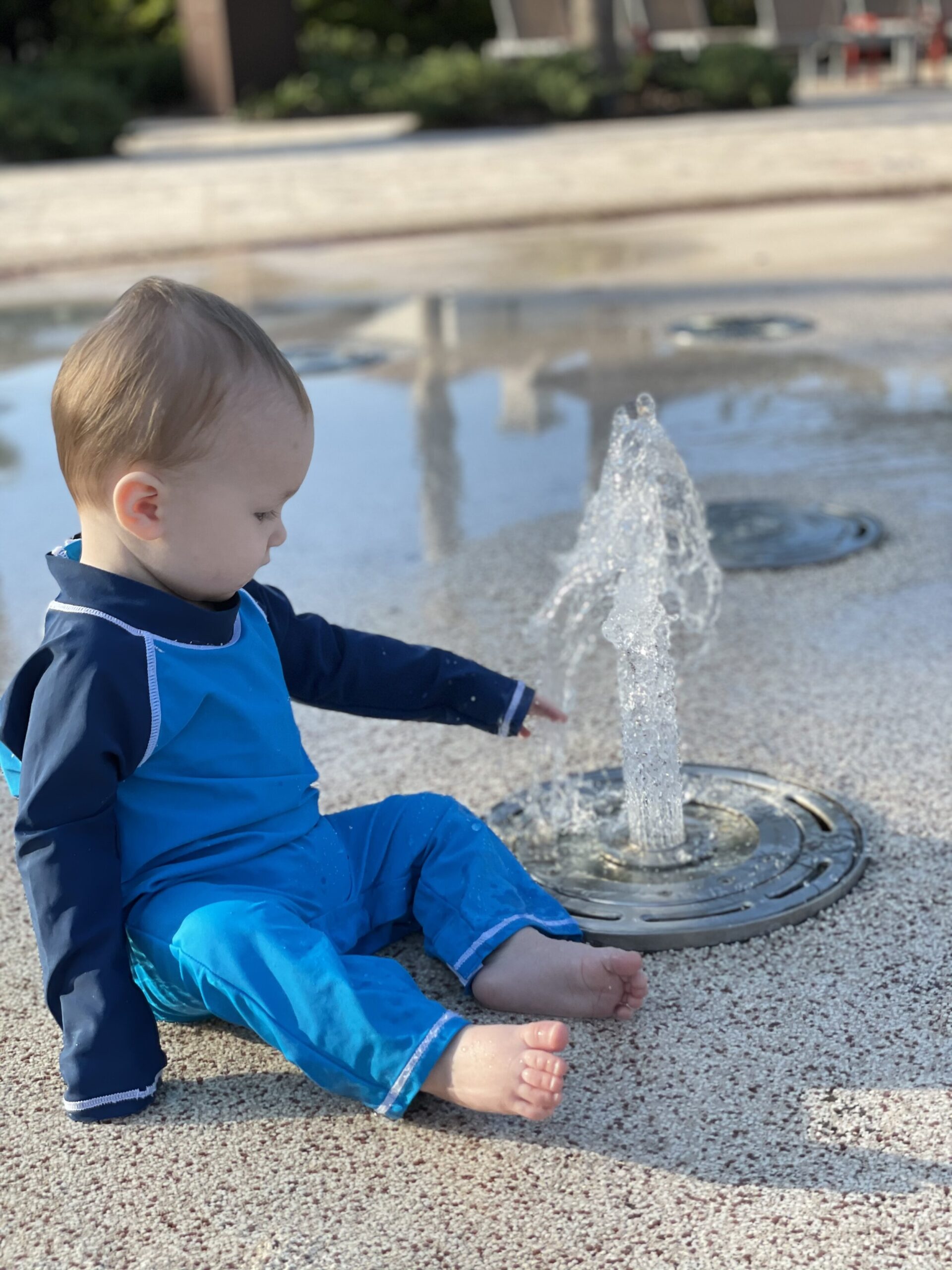 The splash pad was perfect for Griffin to crawl around and explore. The water depth in the was a little over 1 ft in this area.